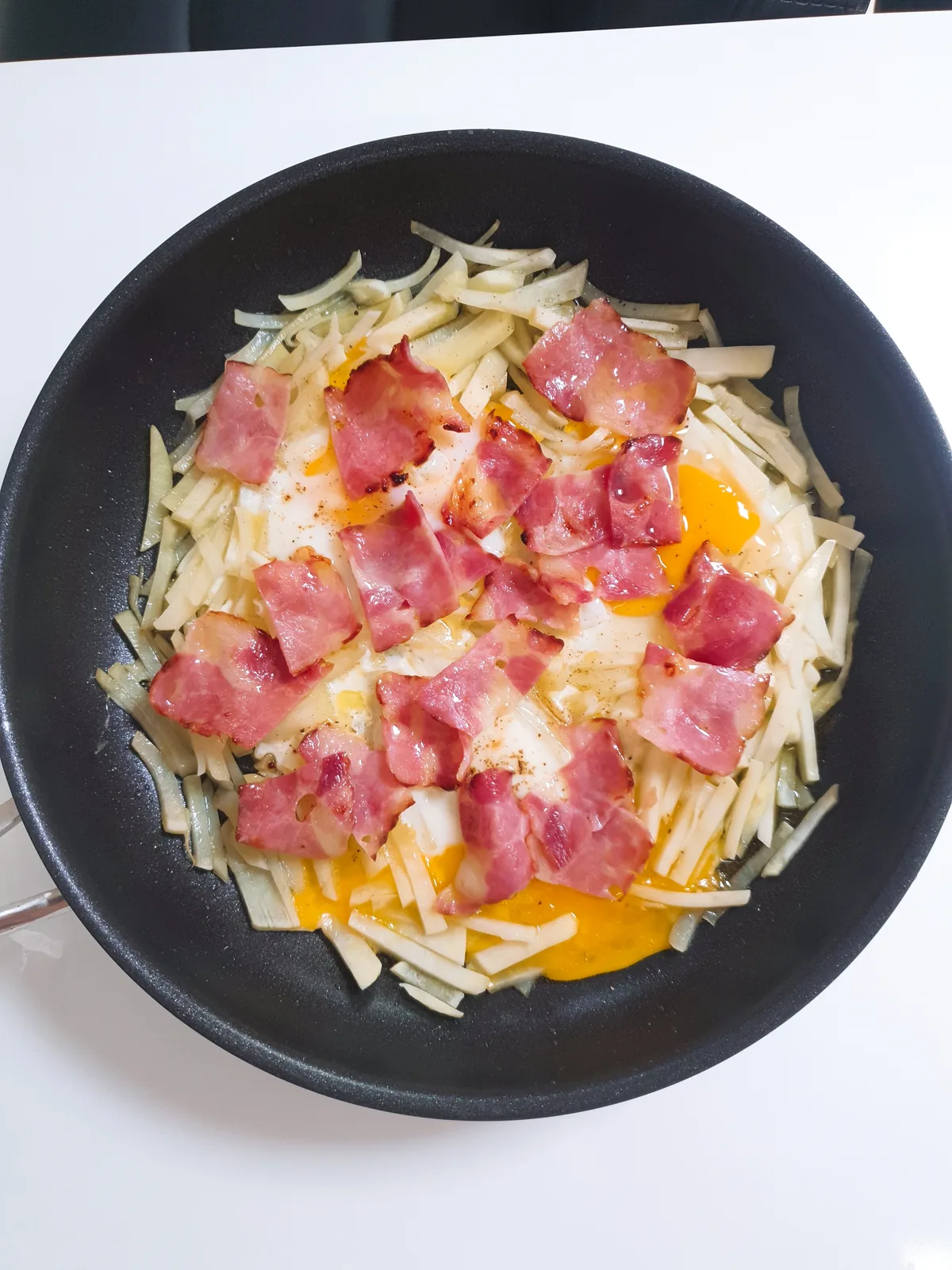 A potato nest variation with bacon and eggs