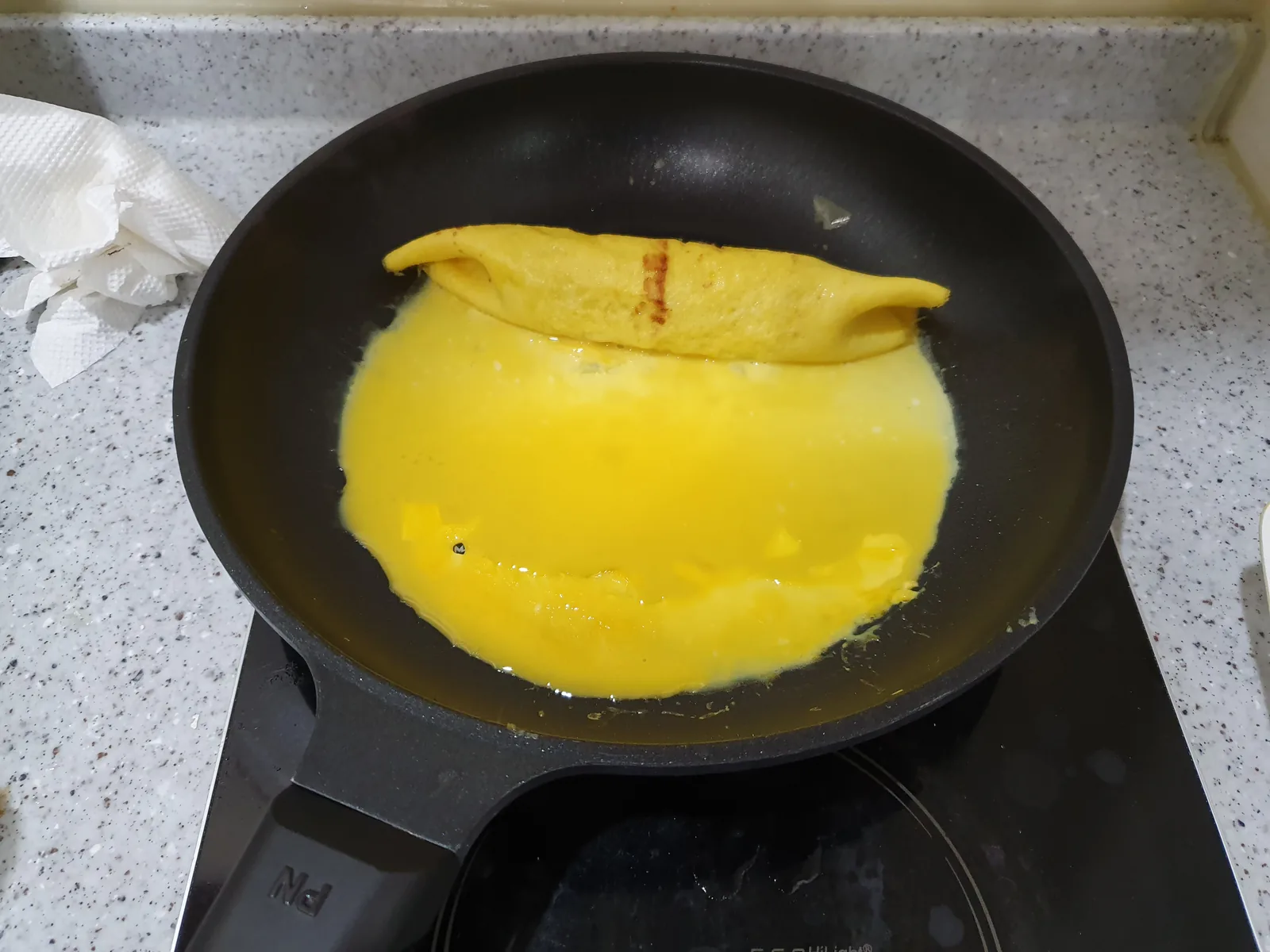 Eggs being rolled in a pan