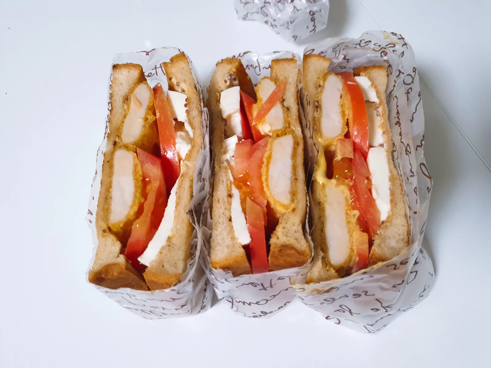 A batch of sandwiches cut into pieces
