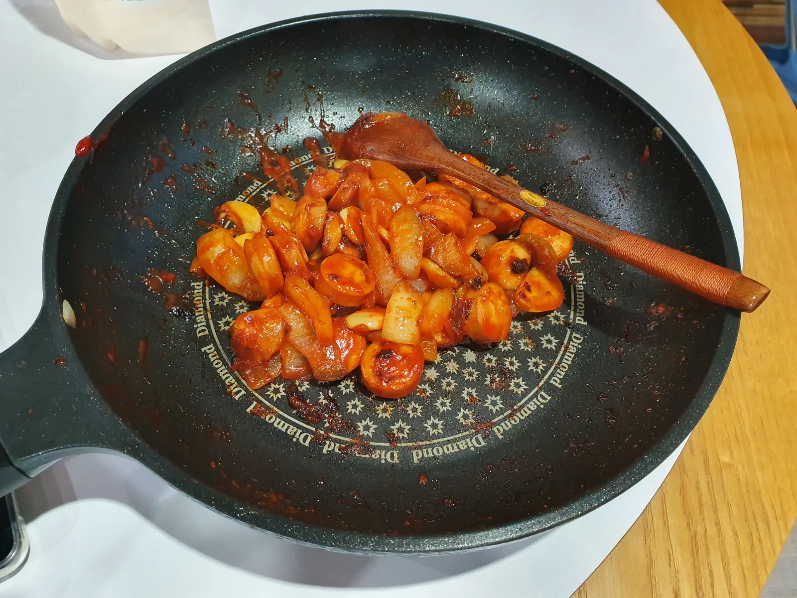 Sausage and vegetables cooking in a pan