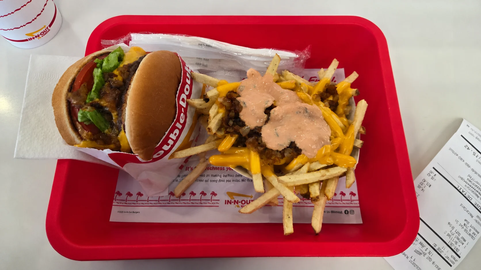 An In-N-Out Double-Double and Animal Style Fries on a tray