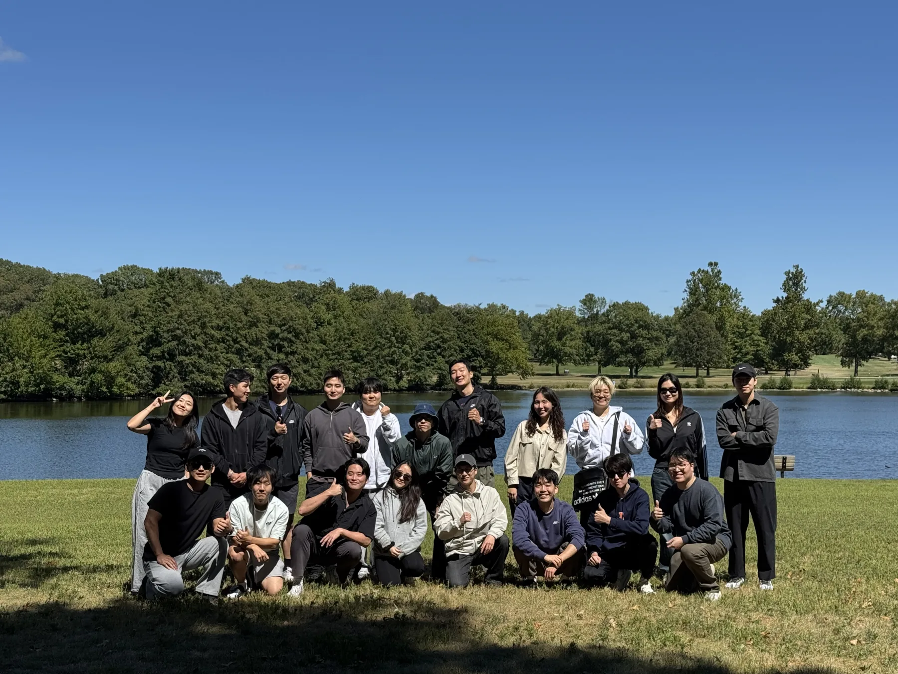 People from the computer science department at a barbecue beside a lake