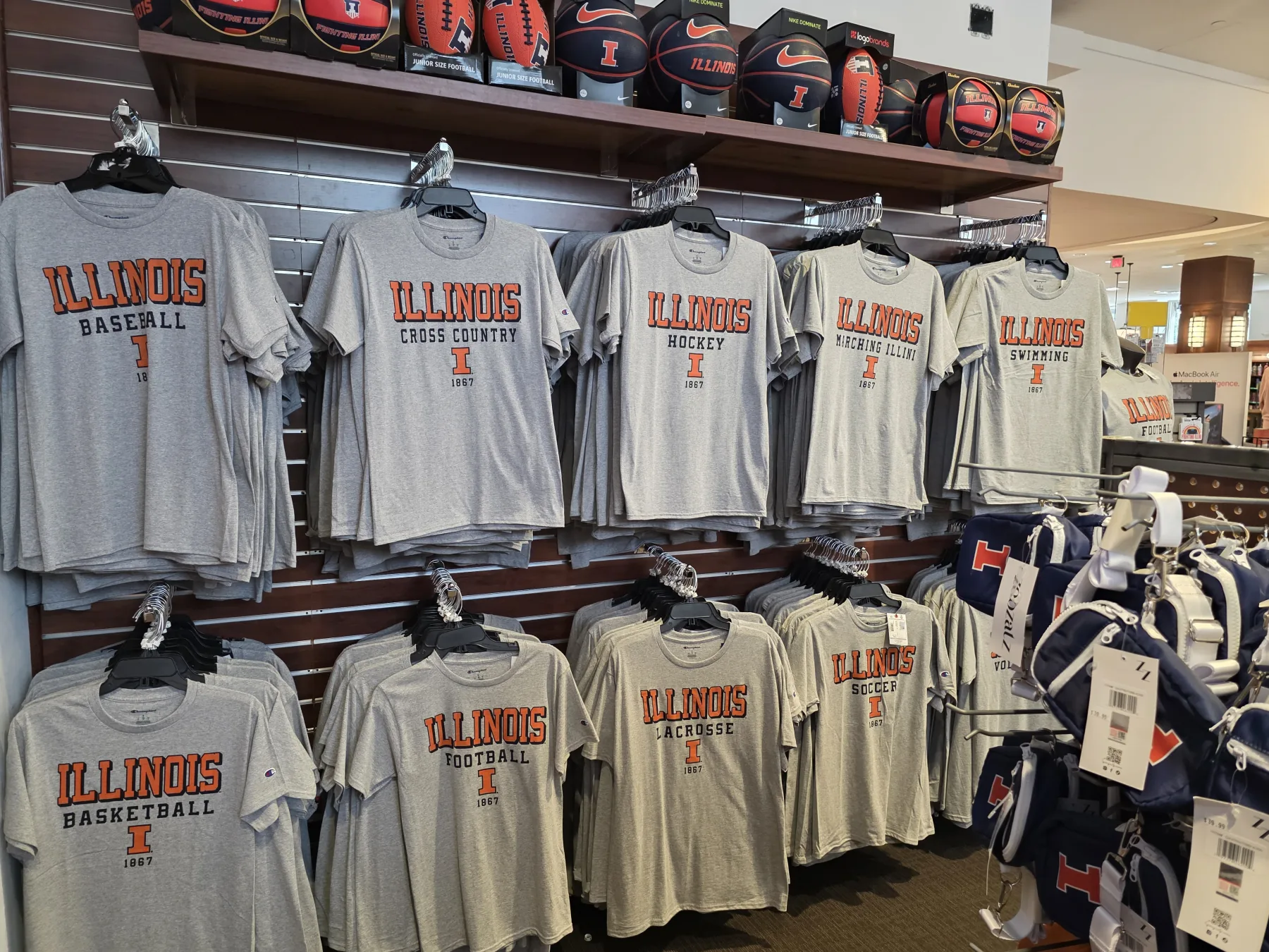 Rows of Illinois shirts in the campus store