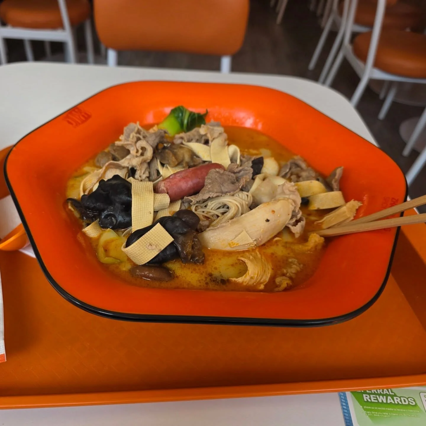 A large bowl of malatang with assorted ingredients
